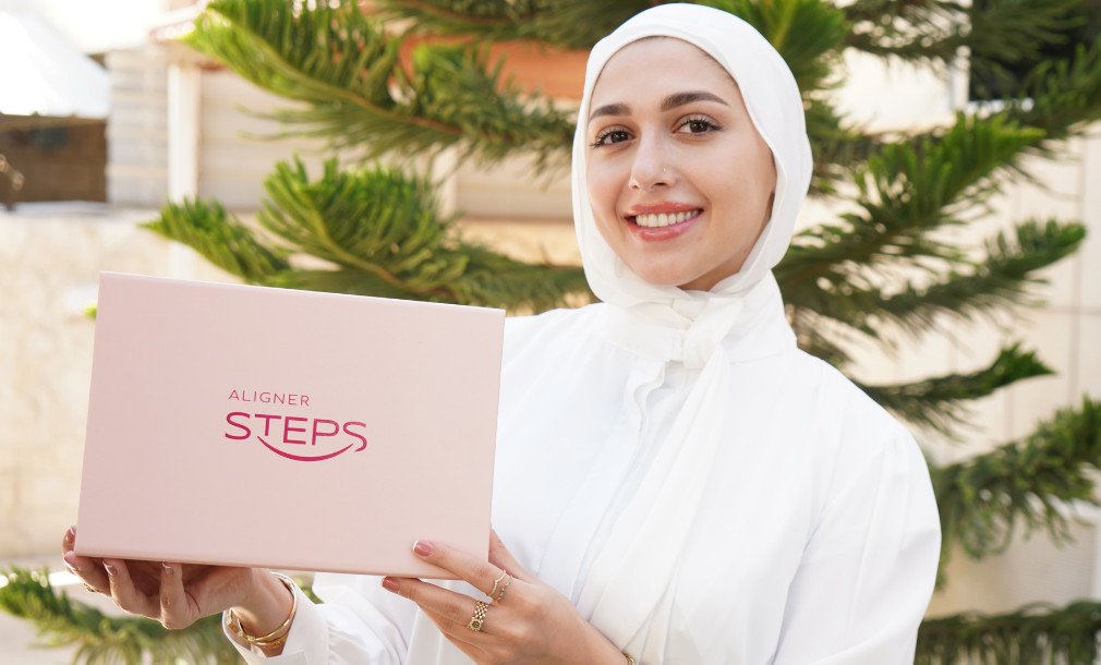 Dental clinic consultation — two staff members at reception desk